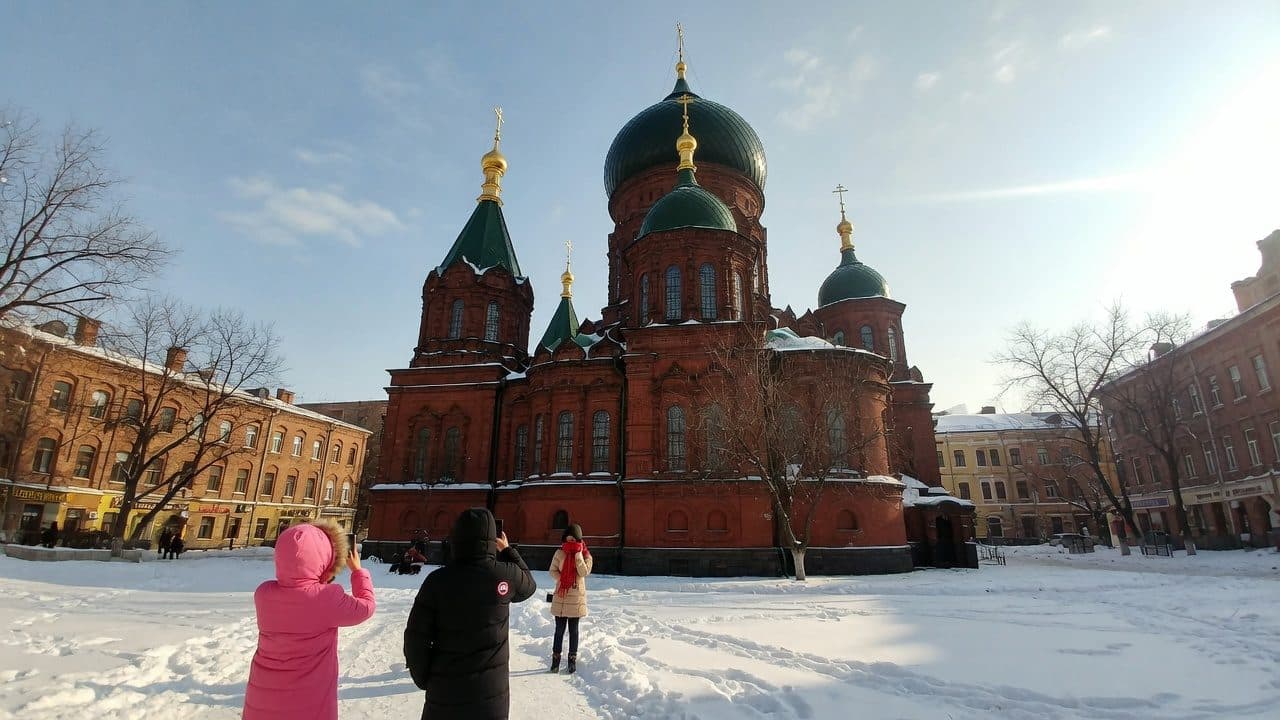 The green onion domes of the Church of St Sophia above the snow in Harbin