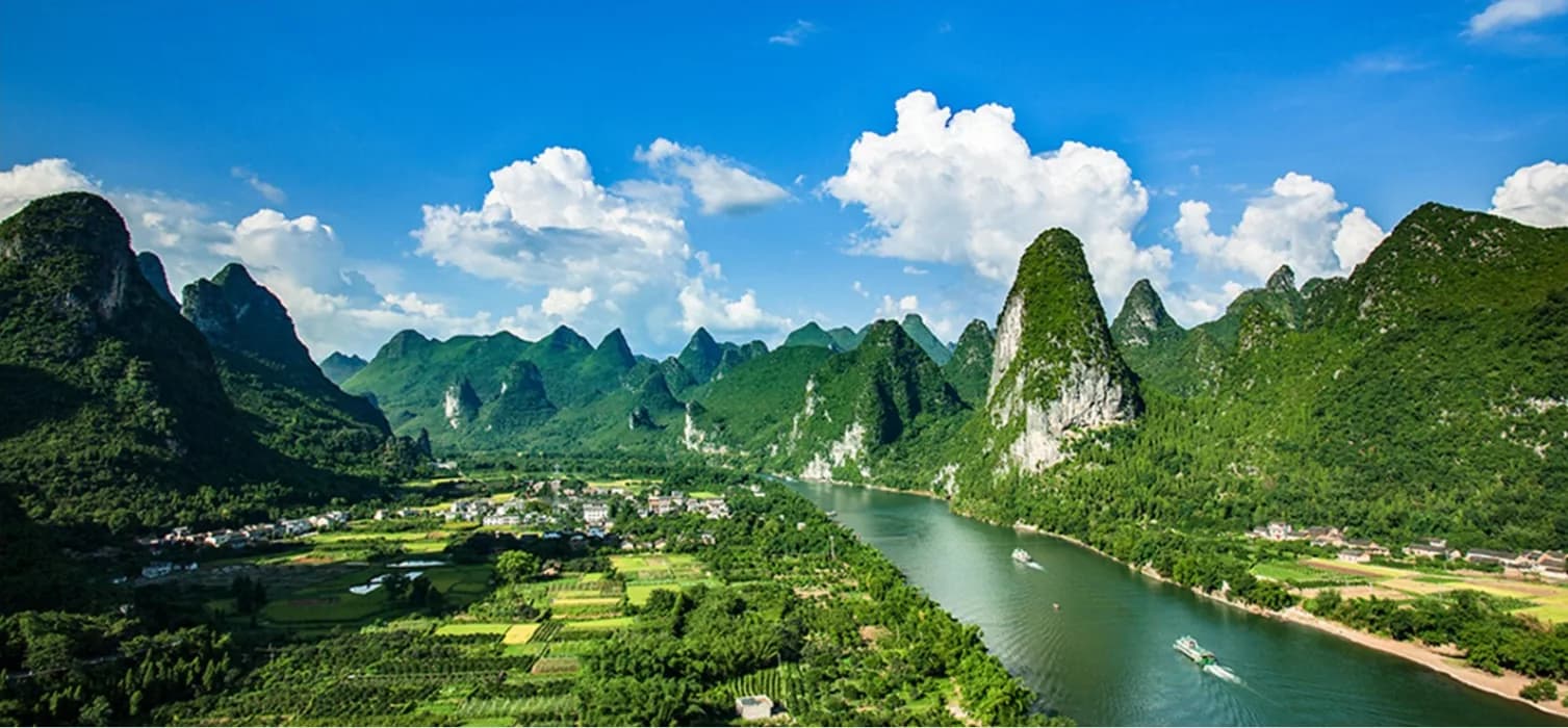 The Li River winding between karst peaks above a farmed valley floor