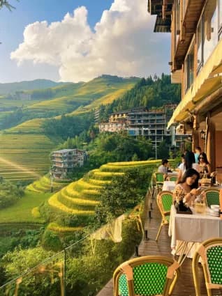 Guesthouse terrace tables looking out over the Longji rice terraces