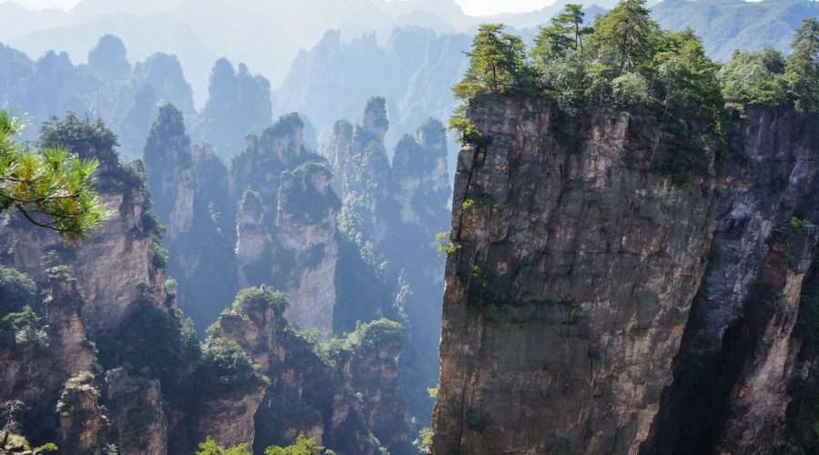 Sandstone pillars of Zhangjiajie above the forest