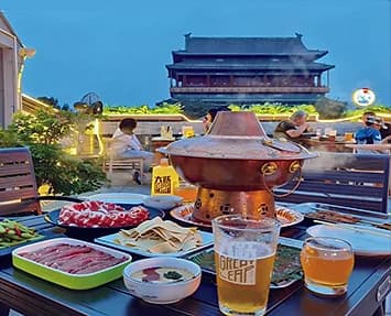 Mongolian hot pot set on a rooftop table