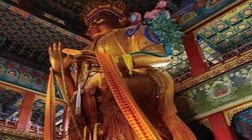 Gilded Buddha figure at Yonghe Lama Temple