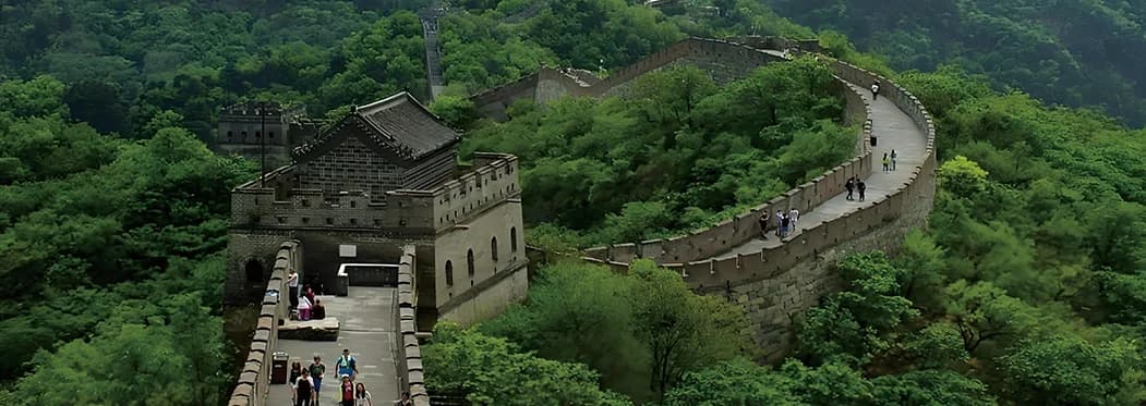 Mutianyu Great Wall winding through forested hills