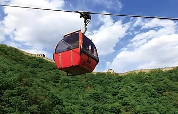 Cable car cabin rising towards the Great Wall