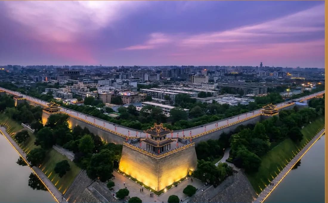 Xi'an city wall lit at dusk seen from above