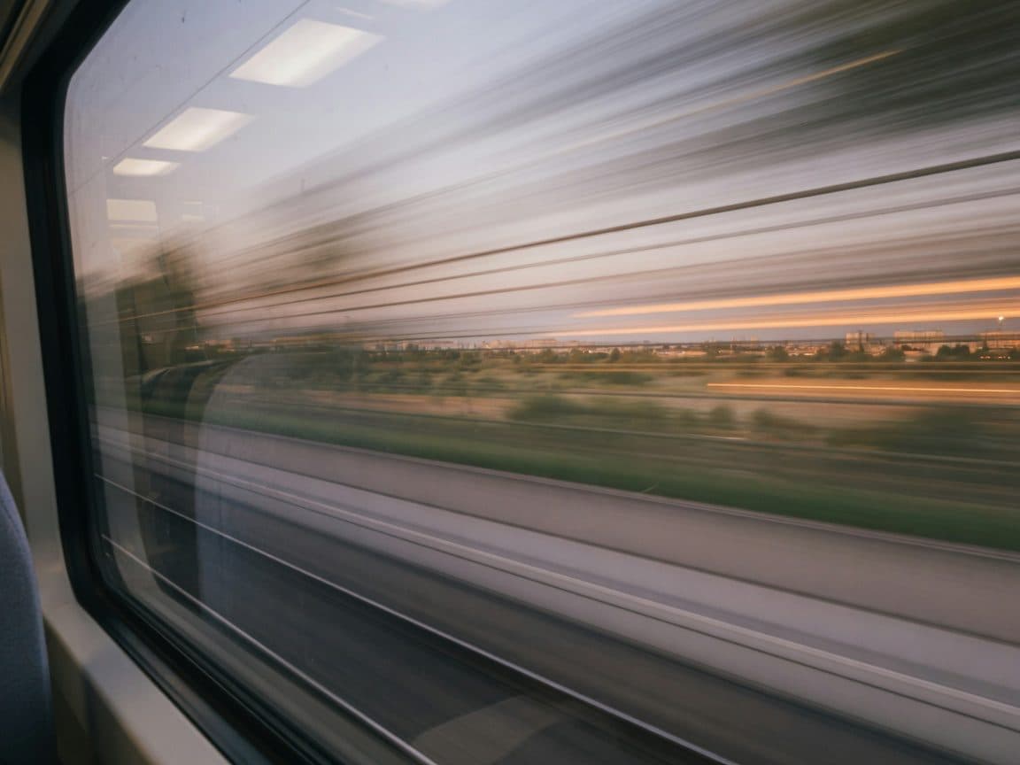 The view through a train window reduced to horizontal streaks by speed